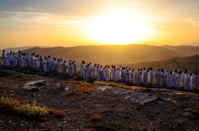 Samaritan worshippers arrive to take part in a Passover ceremony on top of Mount Gerizim, near the northern West Bank city of Nablus