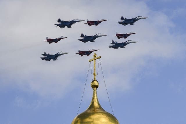 Russian MiG-29 jet fighters of the Strizhi (Swifts) and Su-30SM jet fighters of the Russkiye Vityazi (Russian Knights) aerobatic teams fly in formation over the Cathedral Square of the Kremlin in Moscow during a flypast rehearsal for the WWII Victory Parade