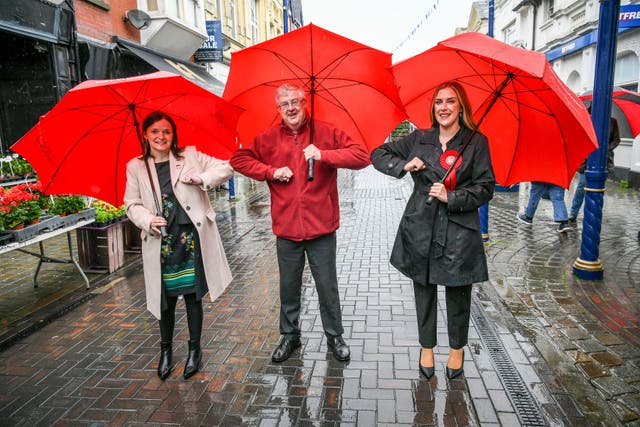Wales First Minister Mark Drakeford elbow bumps newly elected MS Labour candidates Elizabeth Buffy Williams, Rhondda, left, and Sarah Murphy, Bridgend & Porthcawl Labour, right, as they meet in Porthcawl, Wales