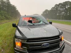 Lightning strike sends chunk of road flying into truck’s windshield, injuring two