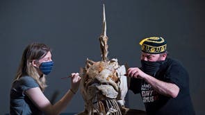 Member of staffs tighten screws and paint a Marlin skeleton, before it goes on display at the Natural History Museum in London, as the museum prepares to reopen to the public on 17 May, following the further easing of lockdown restrictions in England