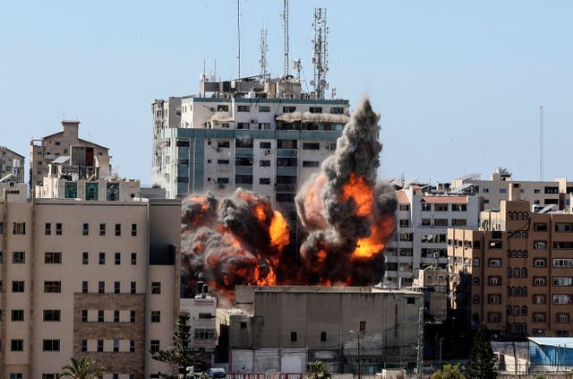 A ball of fire erupts from the Jala Tower as it is destroyed in an Israeli airstrike in Gaza city