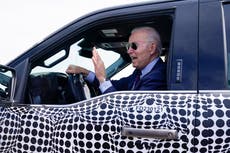 Biden back behind the wheel, zooming away in electric truck