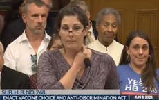 Anti-vaxx nurse tries and fails to make a key stick to her neck during speech claiming that vaccines make people magnetic