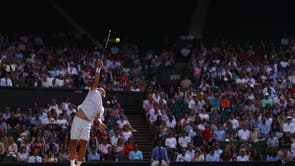 Dan Evans serves against Sebastian Korda during their men’s singles third round match at Wimbledon