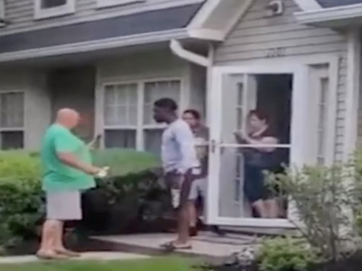 Hundreds protest outside home of man caught on video hurling racial slurs against Black neighbour