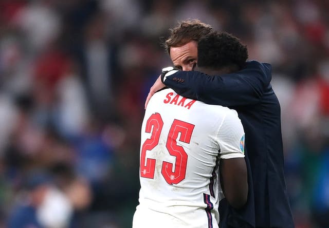 England's Bukayo Saka with manager Gareth Southgate after the match 