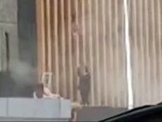 South Africa riots: Mother throws daughter from burning building after looters start blaze