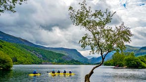 Canoers on Llyn Padarn lake in Snowdonia, Gwynedd. It was announced that the north-west Wales slate landscape has been granted UNESCO World Heritage Status