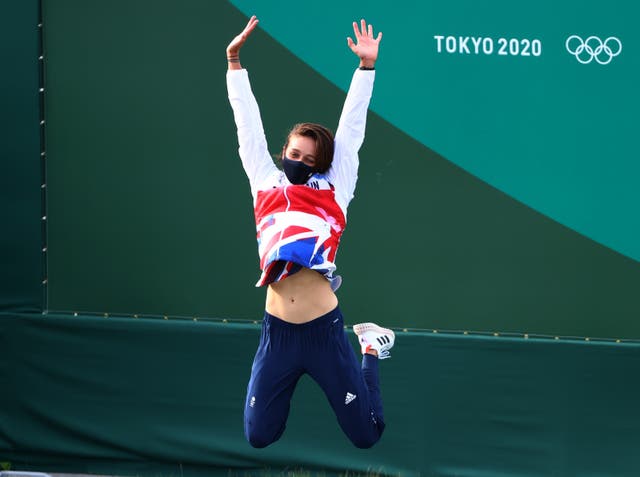 Great Britain’s Mallory Franklin celebrates on the podium after she won silver in the women’s C1 Canoe Slalom at Tokyo Olympics