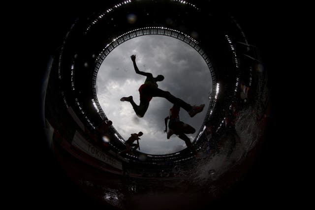Athletes compete during the men’s 3000m Steeplechase at the Tokyo Olympics