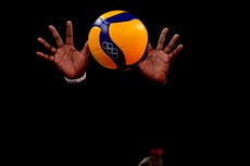 GLIMPSES: In Olympic volleyball, hands from the darkness