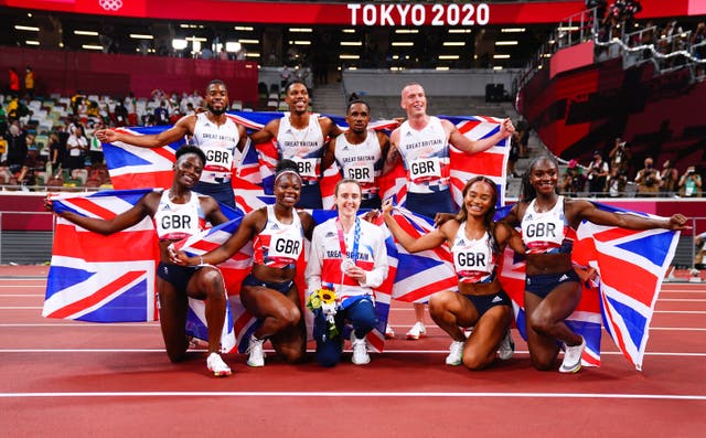 Chijindu Ujah of Britain, Zharnel Hughes of Britain, Richard Kilty of Britain and Nethaneel Mitchell-Blake of Britain celebrate winning silver as they pose with Asha Philip of Britain, Imani Lansiquot of Britain, Dina Asher-Smith of Britain and Daryll Neita of Britain after they won bronze in the women's 4 x 100m relay during Olympic Games Day 14