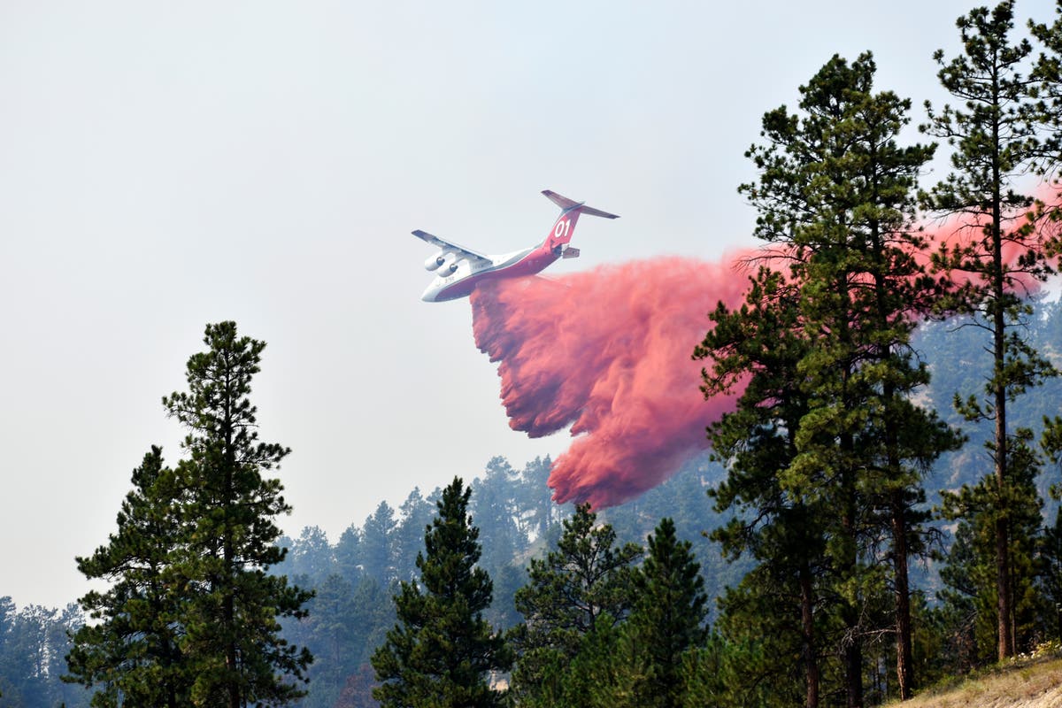 Wildfire bears down on Montana towns as West burns