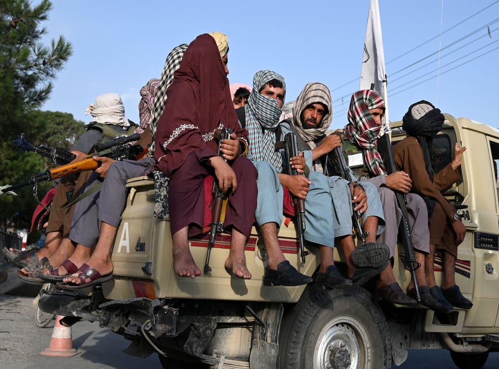 <p>In this file photo taken on 23 août 2021 Taliban fighters in a vehicle patrol the streets of Kabul. </ppgt;