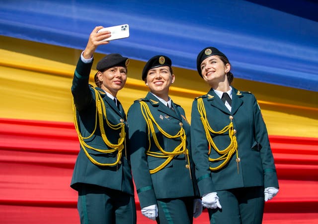 Soldiers take a selfie before a military parade in Chisinau, Moldova