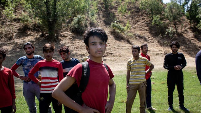 A group of Afghan refugees are seen tracking from the Iranian border to the town of Tatvan