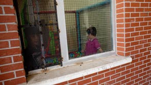 Children are seen playing in the women and families section of Van Deportation Centre, run by the Directorate General of Migration Management