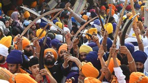 People take part in a religious procession on the occasion of the 417th anniversary of the installation of the Guru Granth Sahib, at the Gurudwara Ramsar in Amritsar