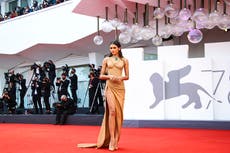AP PHOTOS: Elegance and whimsy mix at Venice Film Festival