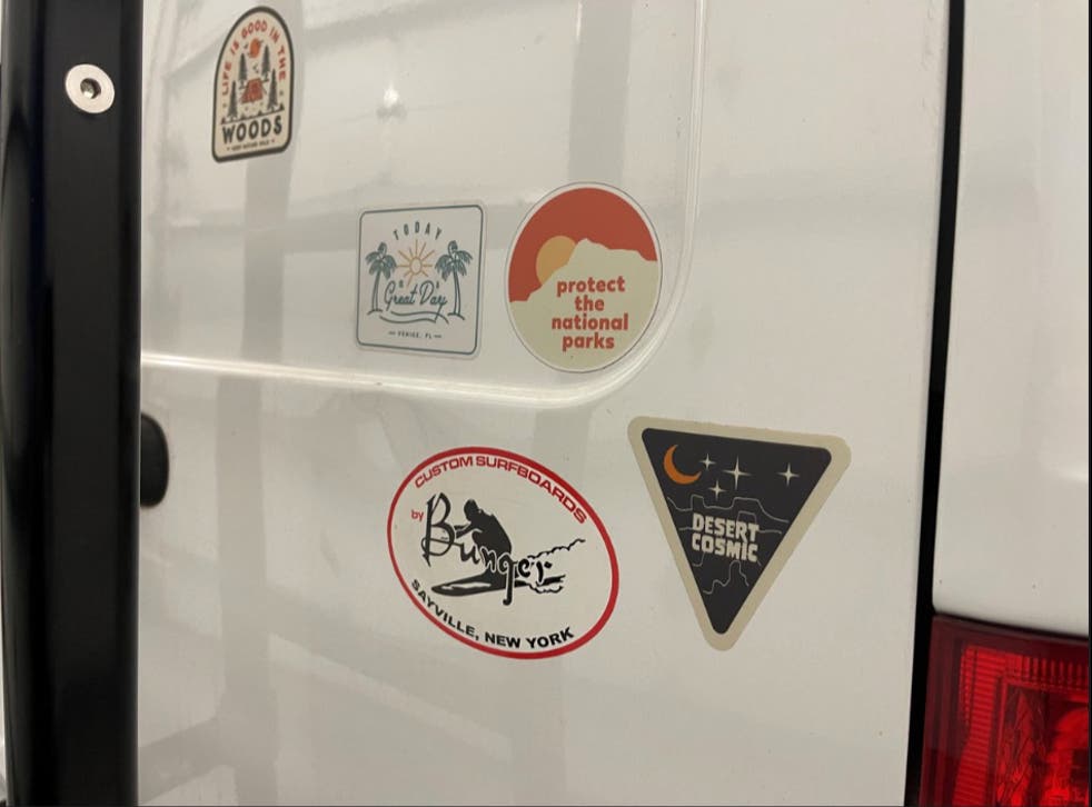 <p>Stickers on the back of the van used by Gabrielle Petito and her fiance Brian Laundrie. Mr Laundrie returned from the trip without Ms Petito, prompting a police search. </磷>
