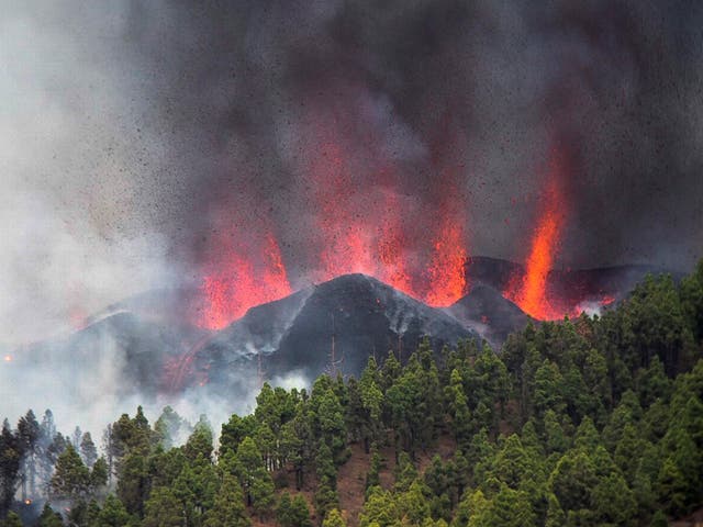 Smoke and magma rise to the sky from the volcanic eruption in El Paso, La Palma, Canary Islands