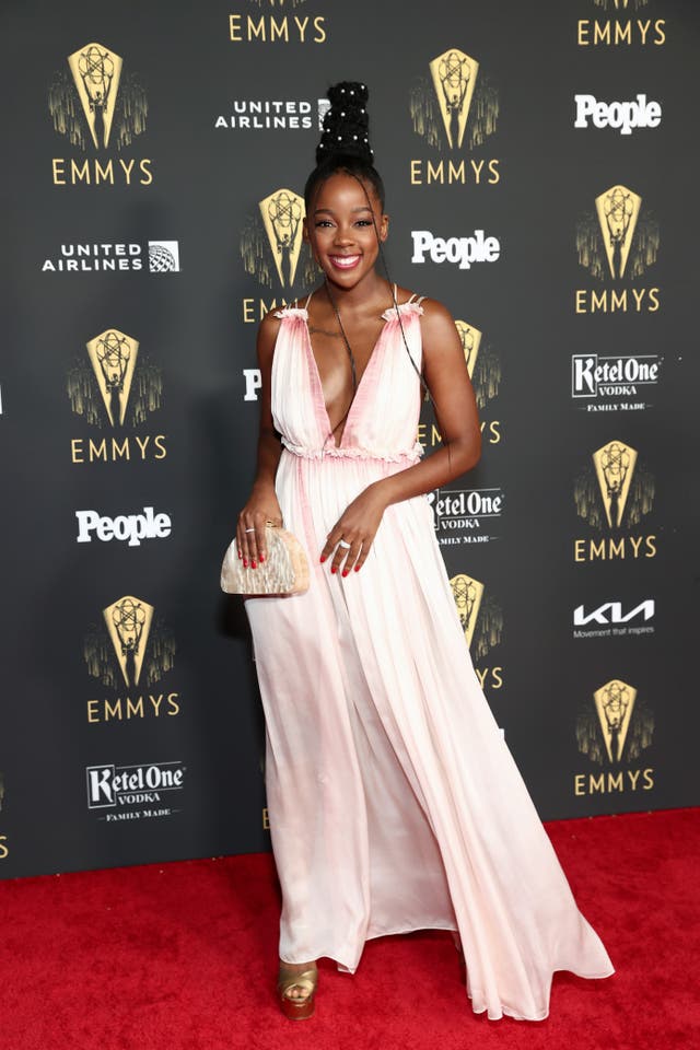 Thuso Mbedu wears a flowing pink and white dress