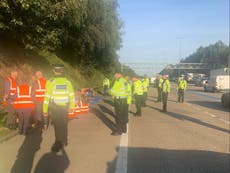 M25 climate protesters dragged off motorway by police