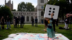 Gabriella, the seven year old daughter of imprisoned British-Iranian Nazanin Zaghari-Ratcliffe, joins in a game on a giant snakes and ladders board in Parliament Square, to show the “ups and downs” of her mother’s case to mark the 2,000 days she has been detained in Iran