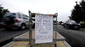 A sign referring to the lack of fuel is placed at the entrance to a petrol station in London