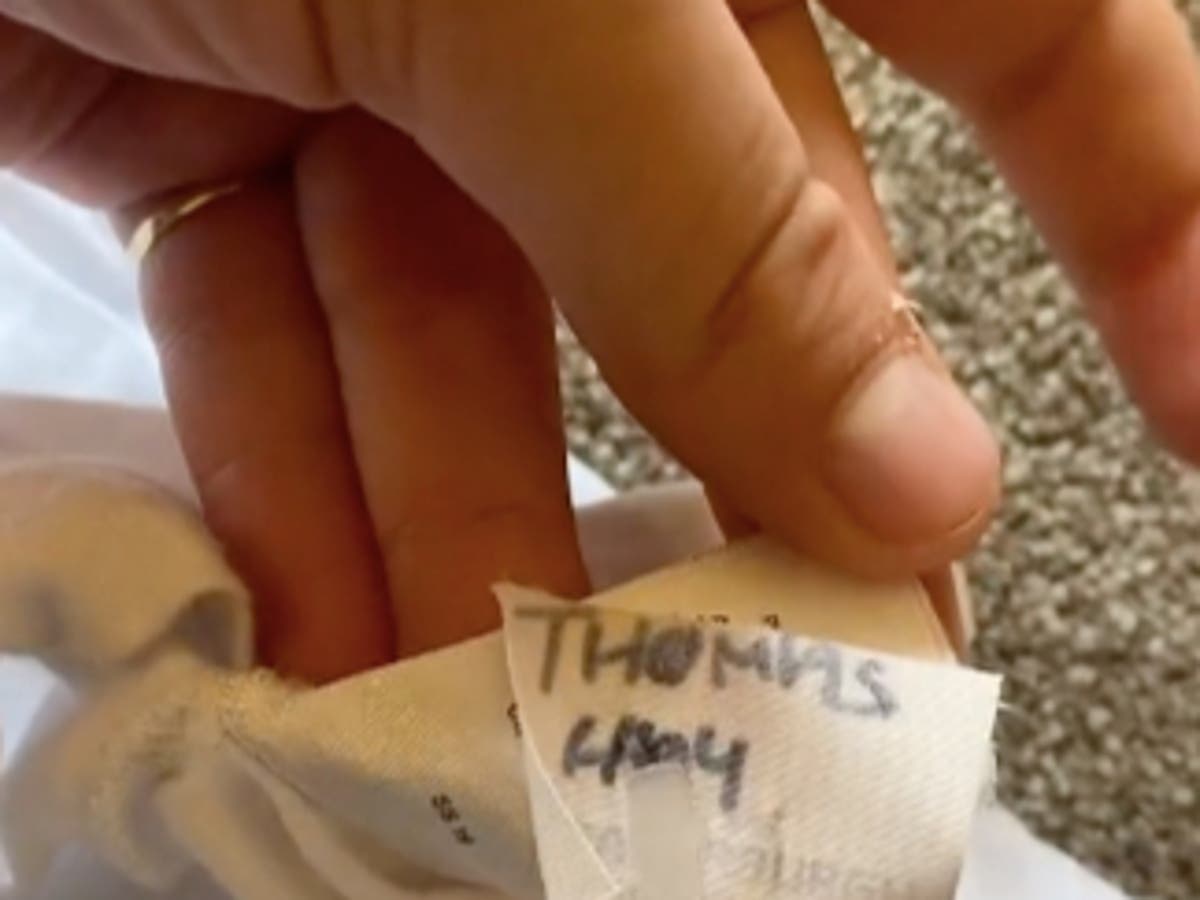 Shopper claims she was sold ‘a dead man’s T-shirt’ after finding name tag inside