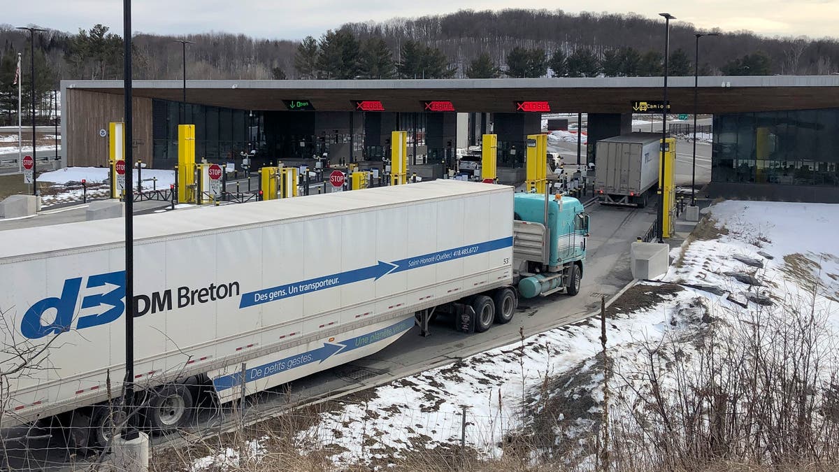 Canadian truckers opposed to vaccine mandates block roads into the US