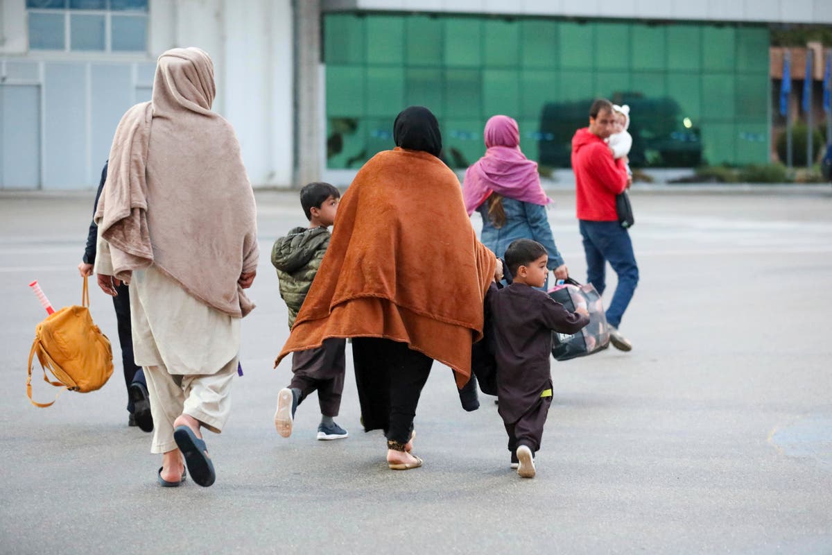Secrecy shrouds Afghan refugees sent by US to base in Kosovo