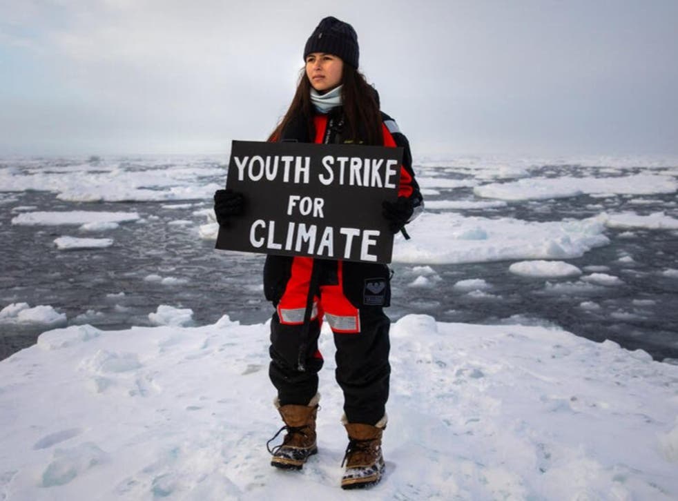 <p>Mya-Rose Craig carrying out a youth climate strike in the Arctic  </p>