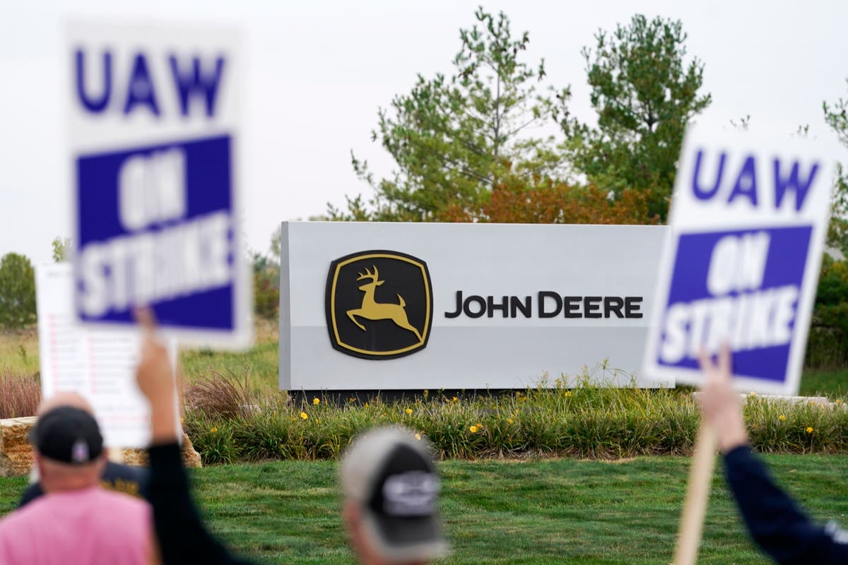Deere, UAW reach tentative pact; strike continues for now