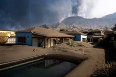 Ash from erupting volcano forces Spanish islanders indoors 