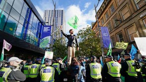 Police and demonstrators at a Extinction Rebellion protest on Buchanan Street, during the Cop26 summit in Glasgow