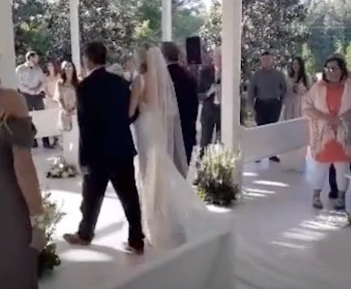 Bride’s father stops walk down the aisle to include her stepfather as well