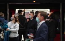 Train passengers express mixed views on return of face masks