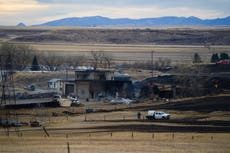 Wind-pushed fires force evacuations, burn homes in Montana