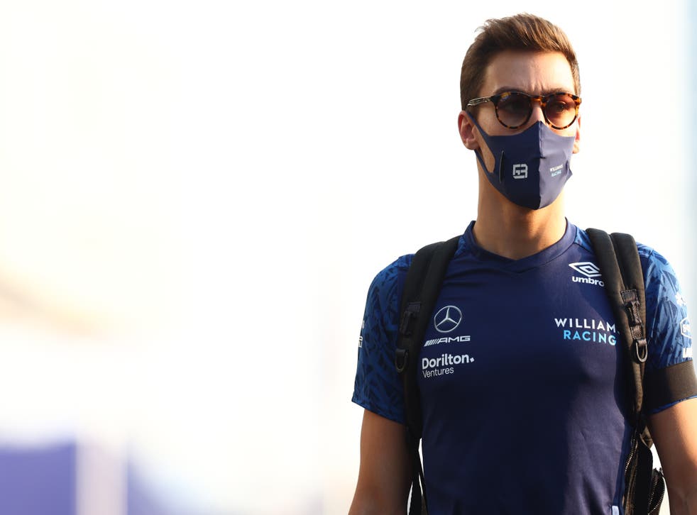 <p>George Russell of Great Britain and Williams walks in the Paddock</p>
