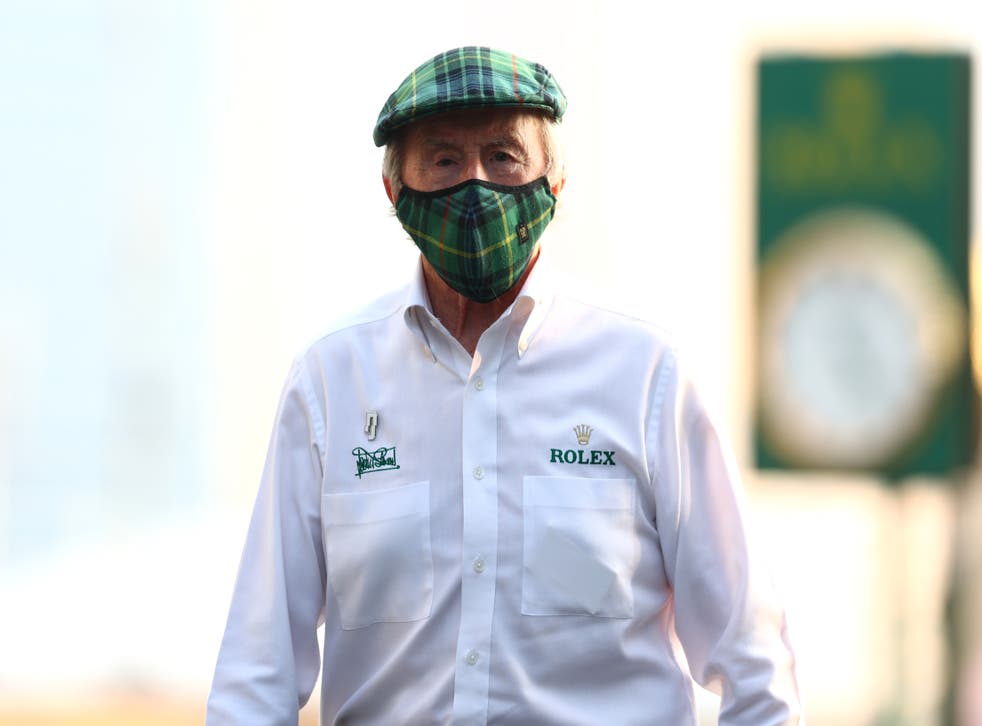 <p>Sir Jackie Stewart walks in the Paddock</p>