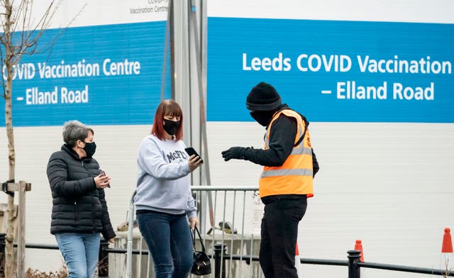 People arrive at a Covid-19 vaccination centre at Elland Road in Leeds,