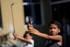 Rio favela seeks to improve kids' lives through golf  