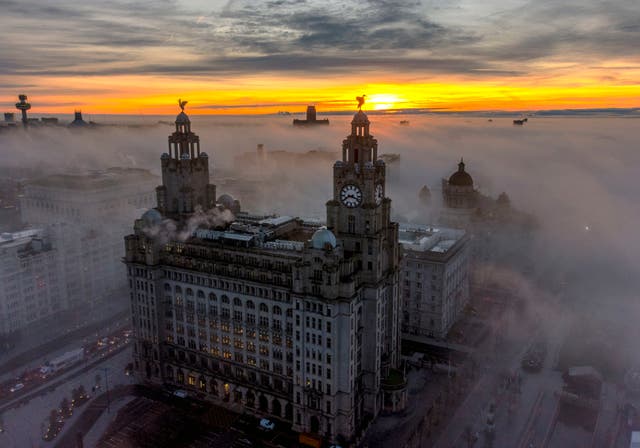 The Royal Liver Buildings surrounded by early morning fog in Liverpool