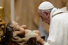 Pope celebrates Christmas Eve Mass as virus surges in Italy