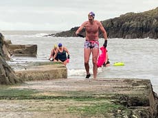 Plucky swimmers start Christmas Day with a dip in the sea