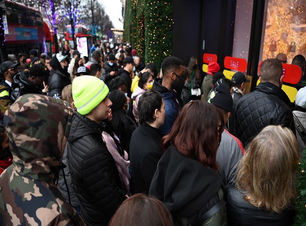 <p>People queue up outside Selfridges for Boxing Day sales on Oxford Street in London, Britain, 26 December 2021. Retailers may suffer this year from a late Sunday opening hours this Boxing Day.</p>