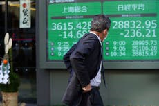 Asian shares mostly slip amid lingering omicron worries
