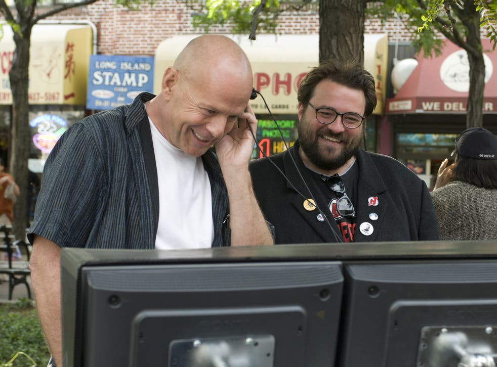 <p>Bruce Willis and Kevin Smith are all smiles on the set of ‘Cop Out'</p>